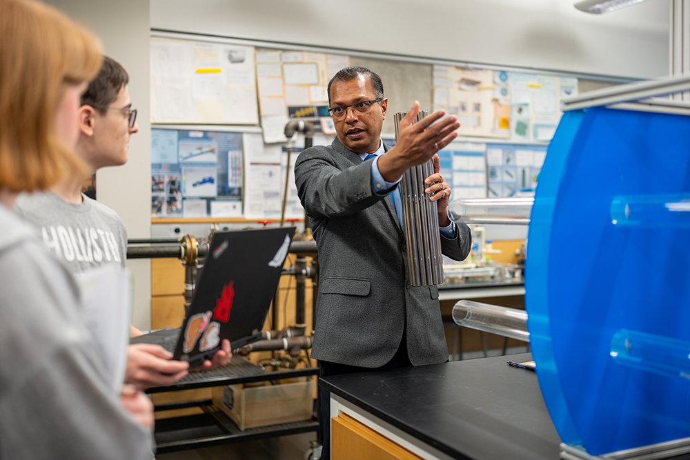 image of Nuclear Engineering students speaking with Sharman Perera, Associate Teaching Professor, Faculty of Engineering and Applied Science 