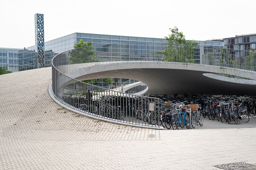 Ontario Tech researchers visited this bicycle parking area at Denmark’s University of Copenhagen that also allows for water collection from cloud bursts. This is an example of how architects are integrating climate adaptations into their designs, making public spaces more visually appealing, and multi-purpose. (September 2023)