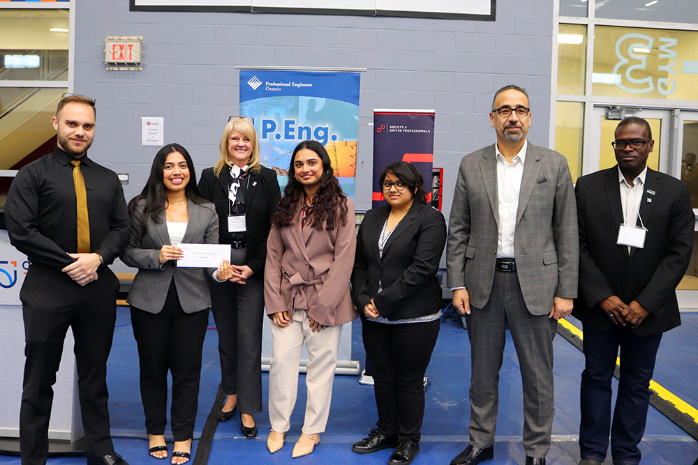 From left to right: Massimo Albanese, Hima Paul, Michelle Johnston, President of Society of United Professionals, Lyba Mughees, Abida Choudhury, Hossam Kishawy, Dean, Faculty of Engineering and Applied Science, Rohan Service, Chair of Professional Engineers Ontario Lake Ontario Chapter