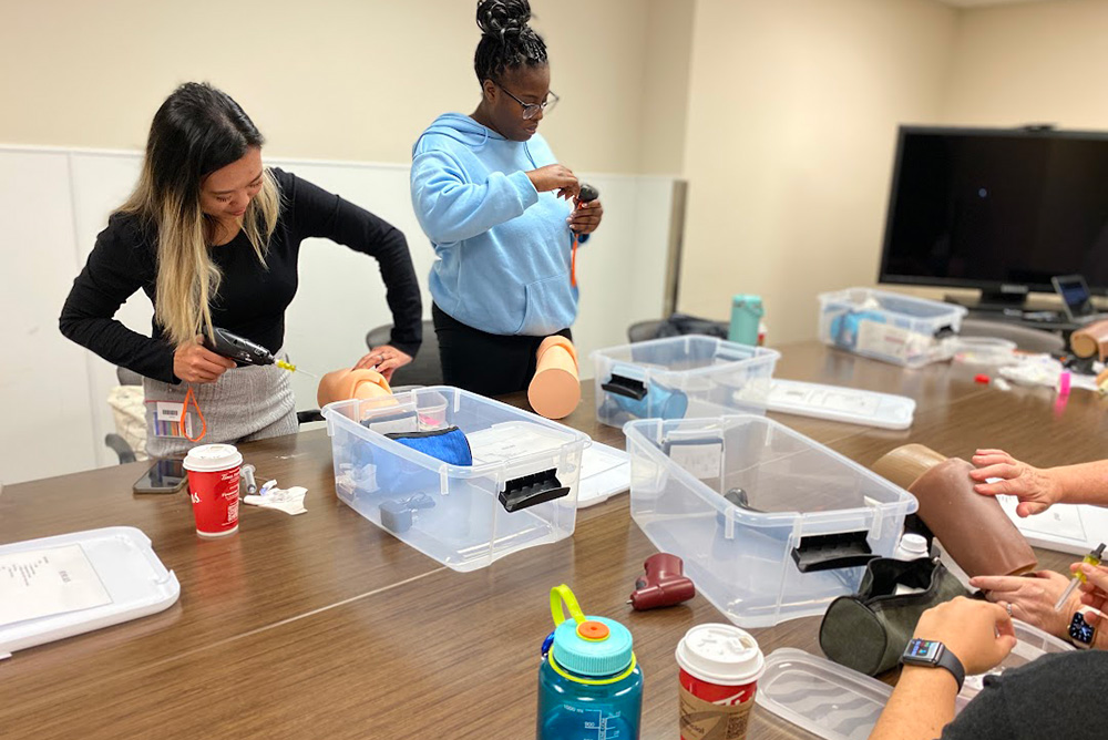 Lakeridge Health Critical Care staff practising landmarking and correct insertion technique with simulation training drill. 