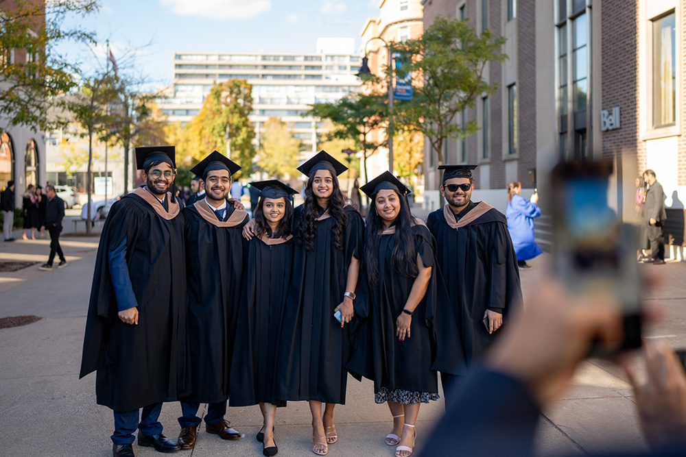 image of Ontario Tech graduates outside the Regent Theatre.