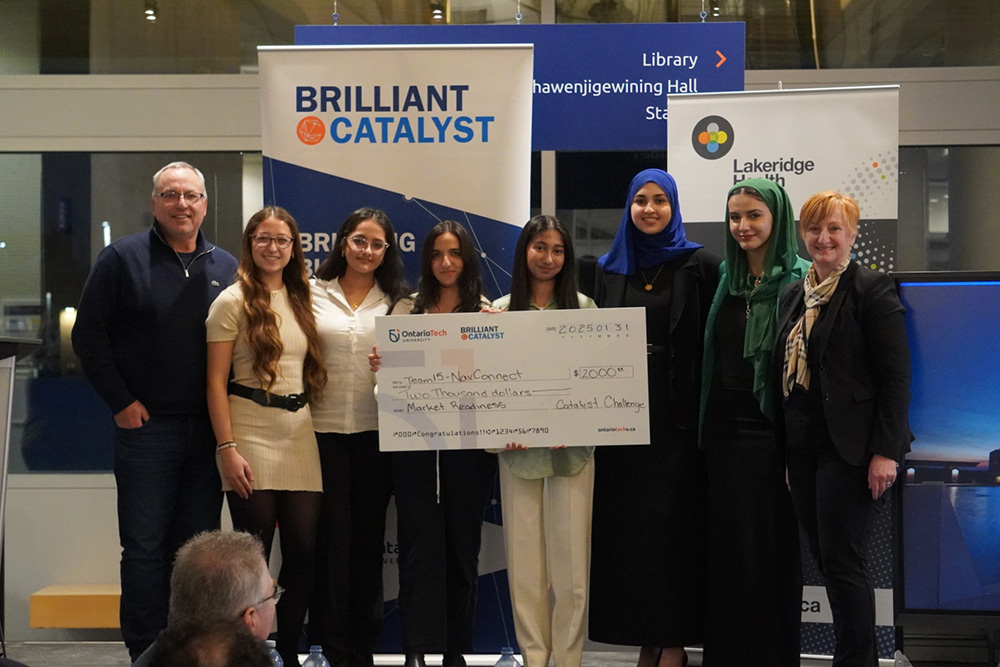 Team NavConnect, winners of the Catalyst Challenge's Market Readiness Award, with Dr. Steven Murphy, President and Vice-Chancellor, Ontario Tech University (left), and Cynthia Davis, President and Chief Executive Officer, Lakeridge Health (right).