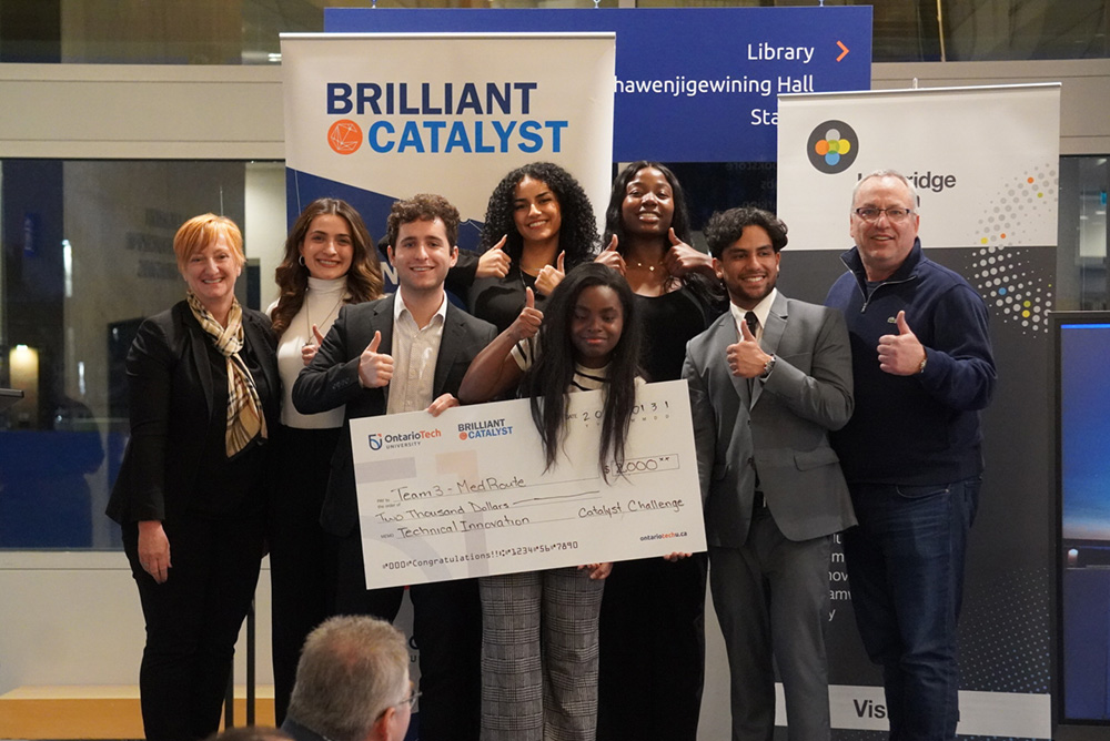 Team MedRoute, winners of the Catalyst Challenge's Technical Innovation Award, with Cynthia Davis, President and Chief Executive Officer, Lakeridge Health (left), and Dr. Steven Murphy, President and Vice-Chancellor, Ontario Tech University (right).