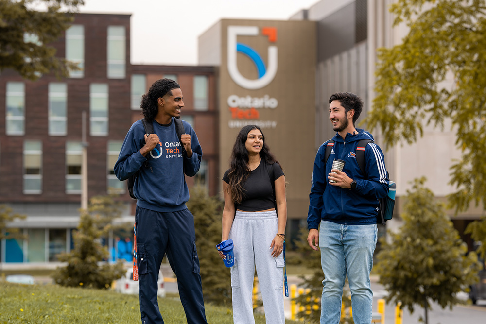 Students outside of Shawenjigewining Hall, at Ontario Tech university's north Oshawa campus.