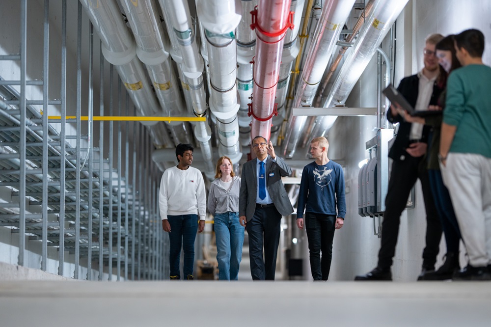 Dr. Sharman Perera, Associate Teaching Professor, Faculty of Engineering and Applied Science (third from left), with Engineering students inside the Borehole Thermal Energy Storage System in Ontario Tech University's Energy Research Centre.