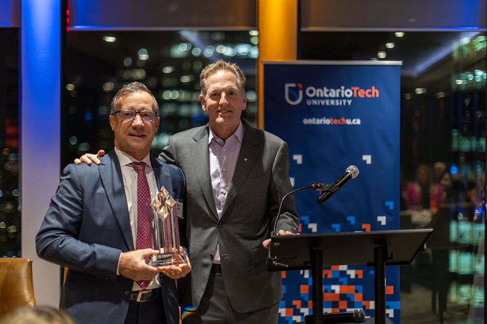 Chancellor Mitch Frazer congratulates Steve Gallant during the Chancellor’s Circle Awards.