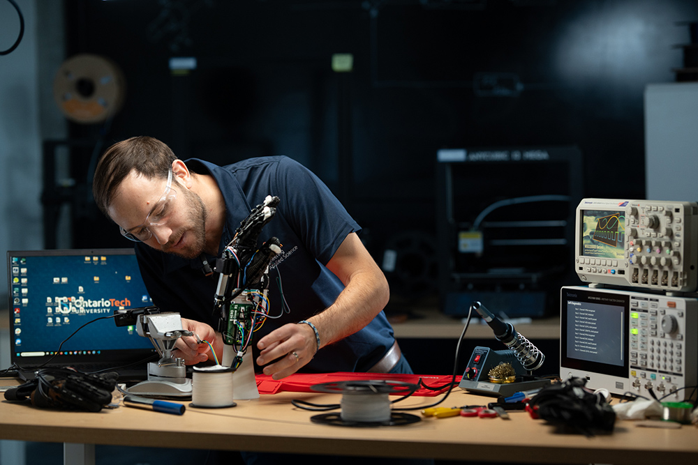 Dr. Aaron Yurkewich, Assistant Professor, Faculty of Engineering and Applied Science, working on the HERO Glove.