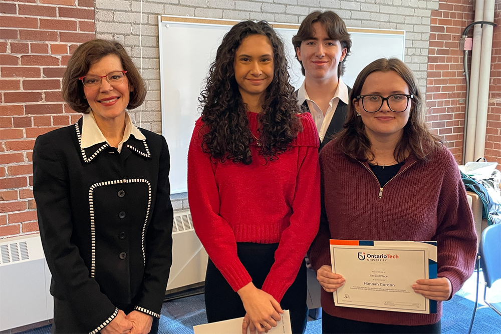 Essay winners Timothy Krantz, Hannah Gordon, Mattea Newallo and Julie Thorburn, Ontario Court of Appeal Judge at the High School Essay Contest award ceremony
