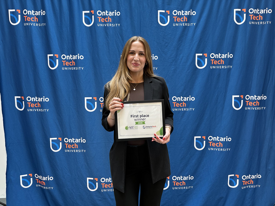 Jessica M. Biasin with her first-place certificate from Ontario Tech’s Three Minute Thesis (3MT®) competition.