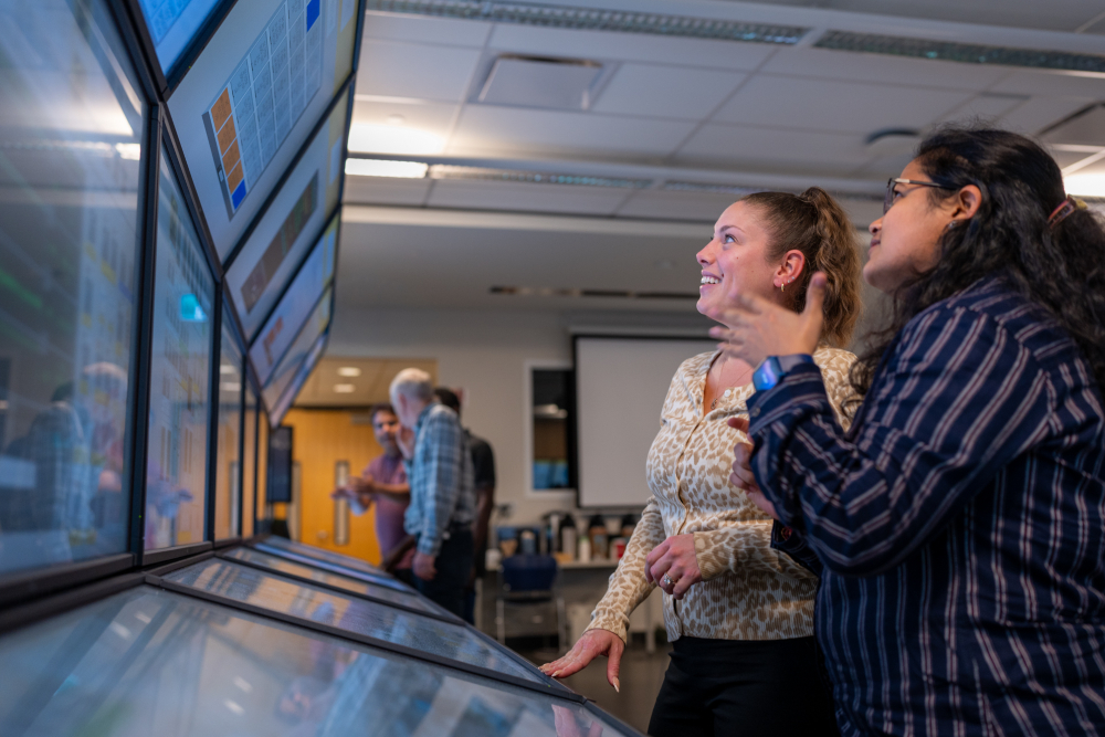 Instructors, staff and students inside Ontario Tech University's Nuclear Simulation Laboratory.