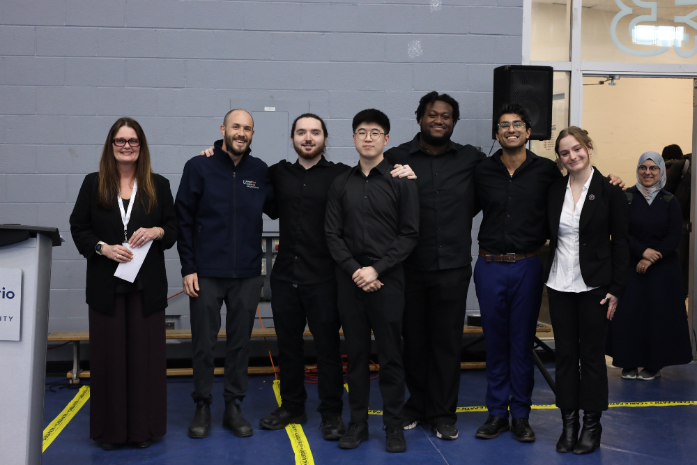 From left: Sponsor Rebecca Caron, President, Society of United Professionals, and Faculty Advisor Dr. Aaron Yurkewich, Assistant Professor, FEAS, with first-place AME/MME team members Joey Falconi, Daniel Jeon, Claude Wellington, Shivansh Joshi and Fiona Kirby.