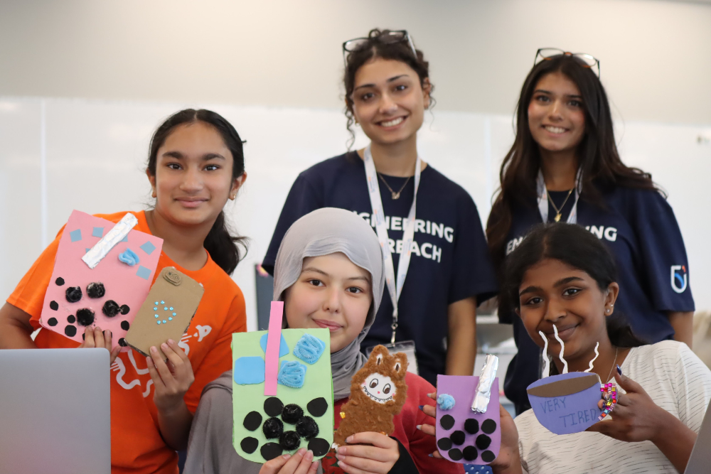 Ontario Tech University Engineering Outreach team members with participants in one of the university's STEM-focused learning programs.