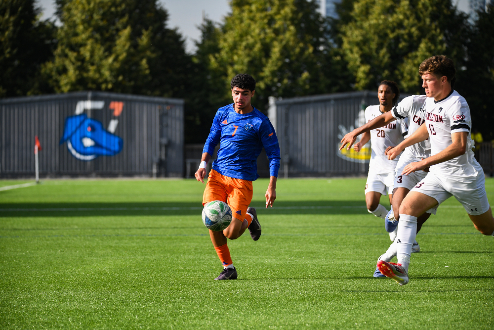 An Ontario Tech Ridgebacks men's soccer athlete in action during competition.