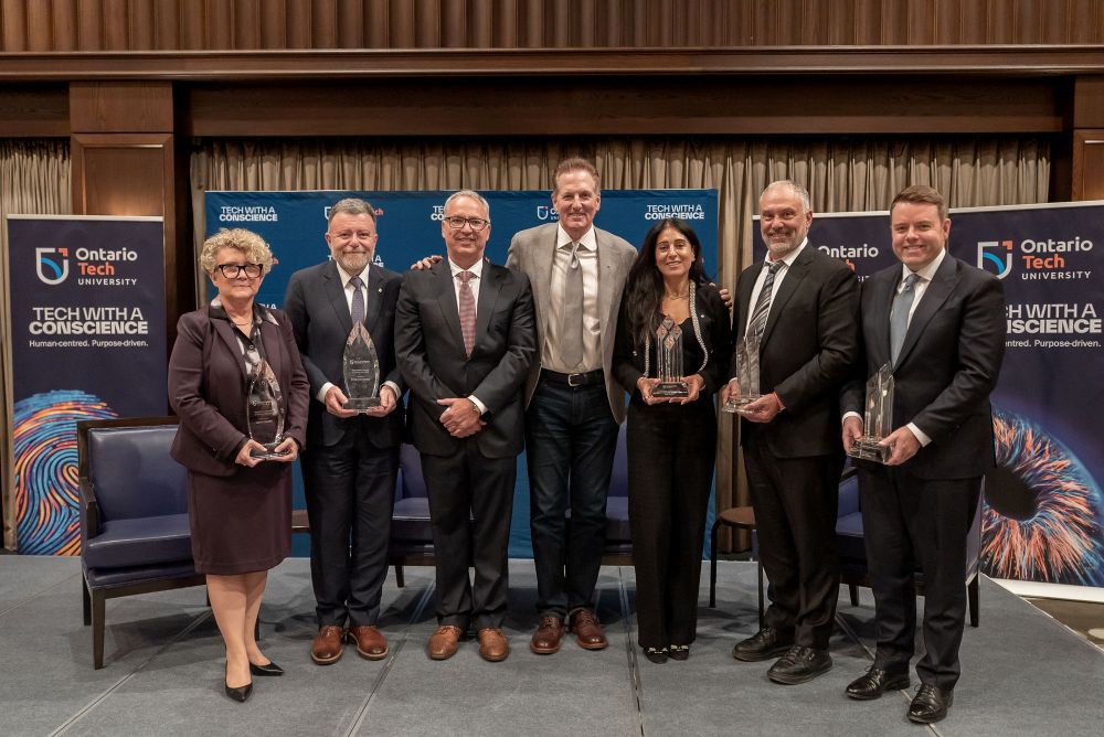 Ontario Tech University recognized five recipients of its 2026 Awards of Distinction at the Chancellor’s Dinner on October 14. From left: Presidential Award of Distinction recipients Laurie Swami and Fred Dermarkar, Ontario Tech President and Vice-Chancellor Dr. Steven Murphy, Ontario Tech Chancellor Mitch Frazer, and Chancellor’s Circle Award recipients Rola Dagher, Rocco Tullio and Regan Watts.